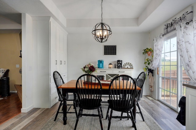 803 W Ridgecrest St, Ozark, MO 65721 - dining space with light wood finished floors, a chandelier, and baseboards