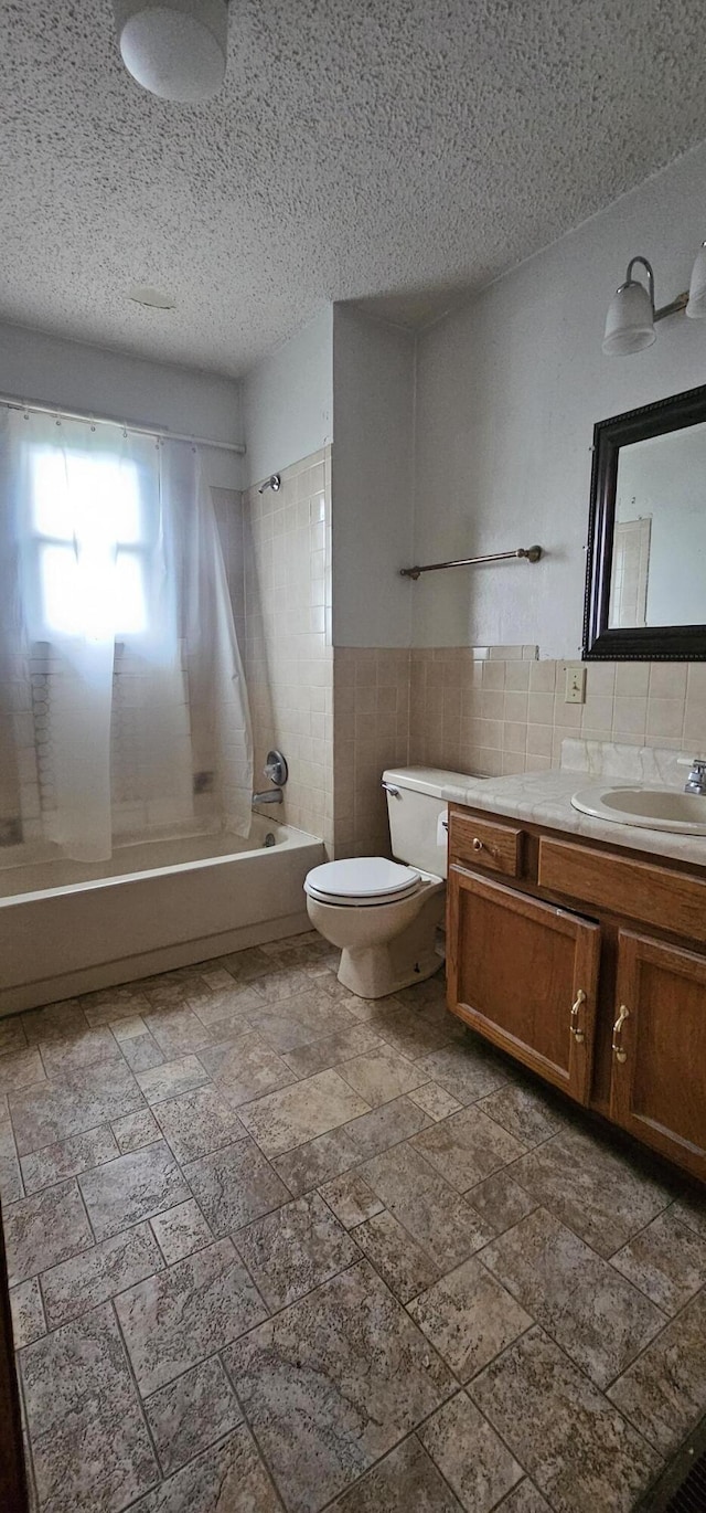 2211 Joanne- Dr, West Plains, MO 65775 - full bath featuring toilet, vanity, tile walls, washtub / shower combination, and a textured ceiling