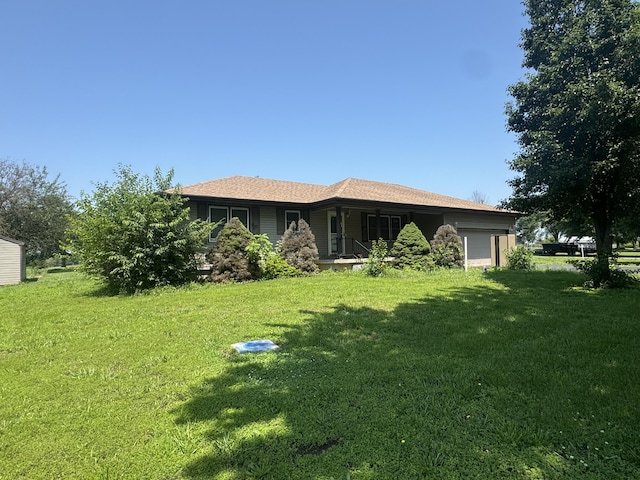 17 Sherwood Trl, Buffalo, MO 65622 - rear view of property featuring an attached garage, a lawn, and covered porch