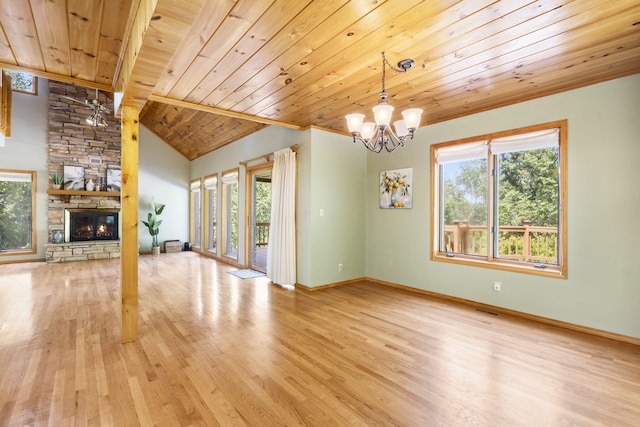 26517 Farm Rd Unit 1212, Eagle Rock, MO 65641 - unfurnished living room featuring wood ceiling, light wood-style floors, plenty of natural light, a chandelier, and a fireplace