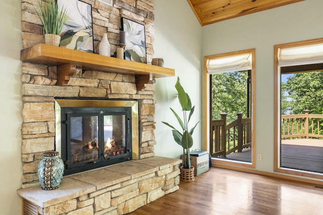 26517 Farm Rd Unit 1212, Eagle Rock, MO 65641 - unfurnished living room featuring a fireplace, lofted ceiling, wood finished floors, and wooden ceiling
