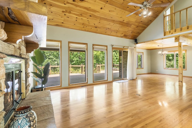 26517 Farm Rd Unit 1212, Eagle Rock, MO 65641 - unfurnished living room with a fireplace, a chandelier, a ceiling fan, high vaulted ceiling, and wood finished floors
