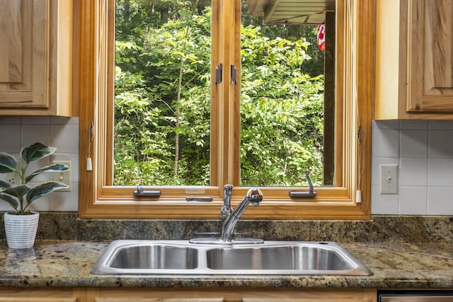 26517 Farm Rd Unit 1212, Eagle Rock, MO 65641 - kitchen view of a sink, decorative backsplash, dishwashing machine, and stone countertops