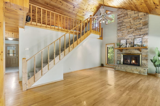 26517 Farm Rd Unit 1212, Eagle Rock, MO 65641 - unfurnished living room featuring high vaulted ceiling, wooden ceiling, wood finished floors, ceiling fan, and stairway