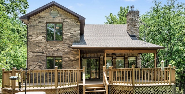 26517 Farm Rd Unit 1212, Eagle Rock, MO 65641 - back of house with a wooden deck, a chimney, a ceiling fan, and a shingled roof