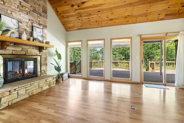 26517 Farm Rd Unit 1212, Eagle Rock, MO 65641 - unfurnished living room with wood finished floors, wood ceiling, vaulted ceiling, a fireplace, and baseboards