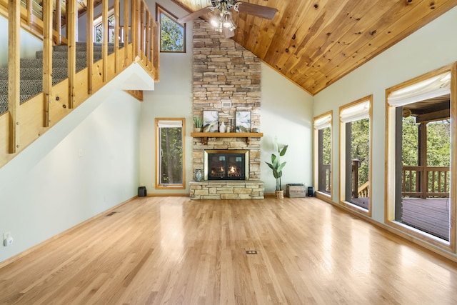 26517 Farm Rd Unit 1212, Eagle Rock, MO 65641 - unfurnished living room with a ceiling fan, wood finished floors, a fireplace, plenty of natural light, and high vaulted ceiling