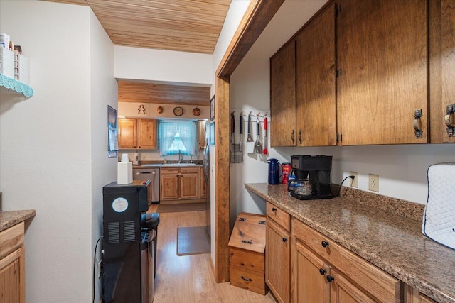 1900 State Highway 76, Anderson, MO 64831 - kitchen featuring light wood finished floors, wooden ceiling, brown cabinets, and stainless steel dishwasher