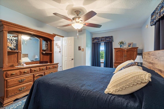 1900 State Highway 76, Anderson, MO 64831 - bedroom featuring a textured ceiling and a ceiling fan