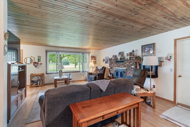 1900 State Highway 76, Anderson, MO 64831 - living area featuring a fireplace, wooden ceiling, light wood-style floors, and baseboards