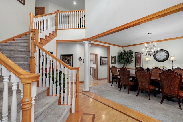 2411 W Dearborn St, Springfield, MO 65807 - dining room with stairway, a chandelier, and wood finished floors