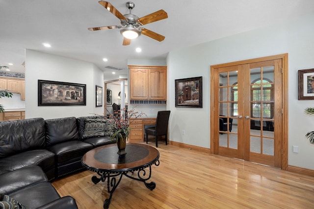 2411 W Dearborn St, Springfield, MO 65807 - living room featuring french doors, light wood finished floors, a ceiling fan, and recessed lighting