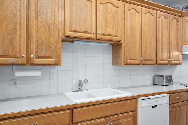 2411 W Dearborn St, Springfield, MO 65807 - kitchen with dishwasher, tasteful backsplash, and light countertops