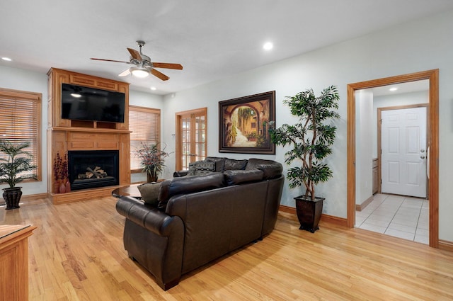 2411 W Dearborn St, Springfield, MO 65807 - living area featuring a ceiling fan, light wood finished floors, a large fireplace, and recessed lighting