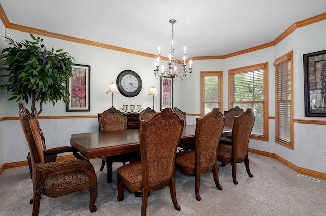 2411 W Dearborn St, Springfield, MO 65807 - dining space featuring carpet, a chandelier, and crown molding
