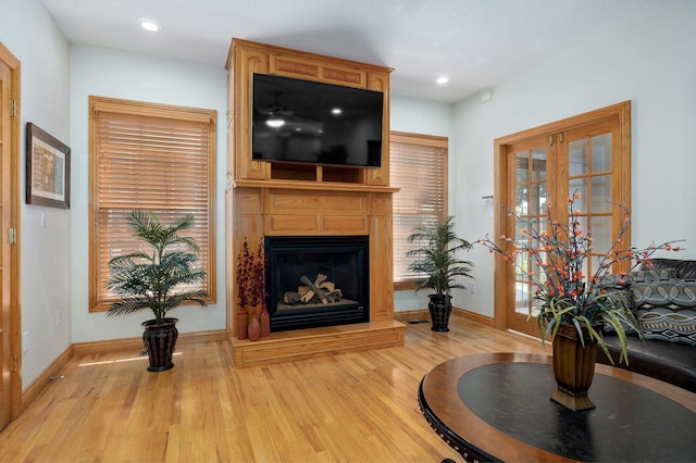 2411 W Dearborn St, Springfield, MO 65807 - living room featuring wood finished floors, a fireplace, and recessed lighting