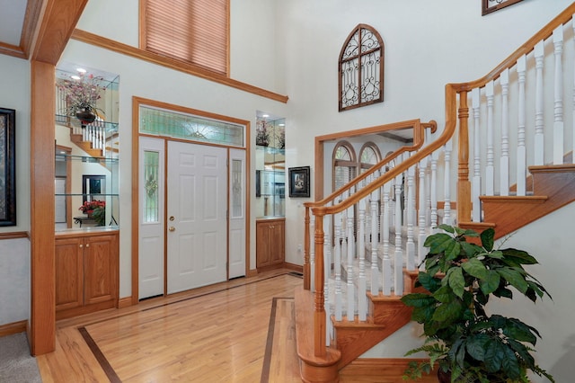 2411 W Dearborn St, Springfield, MO 65807 - entrance foyer featuring light wood-type flooring, stairway, and a high ceiling