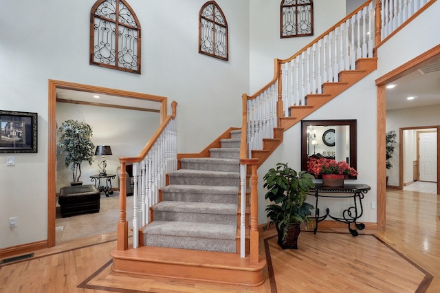 2411 W Dearborn St, Springfield, MO 65807 - stairs featuring wood finished floors and a towering ceiling