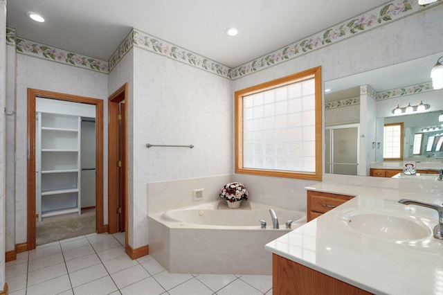 2411 W Dearborn St, Springfield, MO 65807 - full bath featuring a shower stall, vanity, a bath, tile patterned flooring, and wallpapered walls