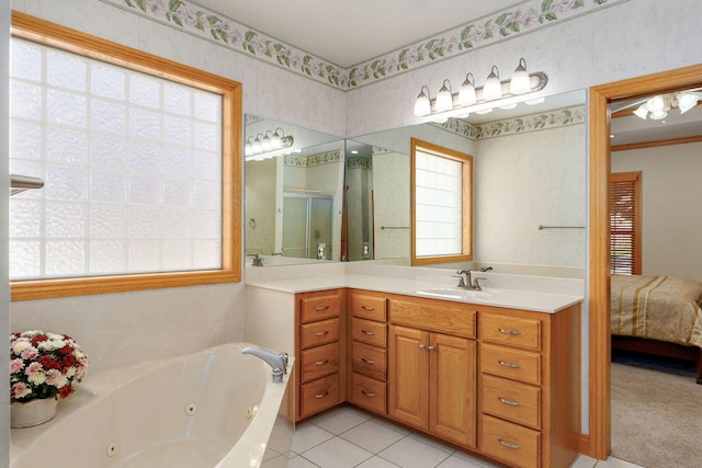 2411 W Dearborn St, Springfield, MO 65807 - ensuite bathroom with a whirlpool tub, vanity, a shower stall, and tile patterned flooring