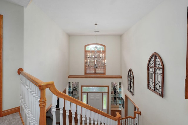 2411 W Dearborn St, Springfield, MO 65807 - stairway with a chandelier and baseboards