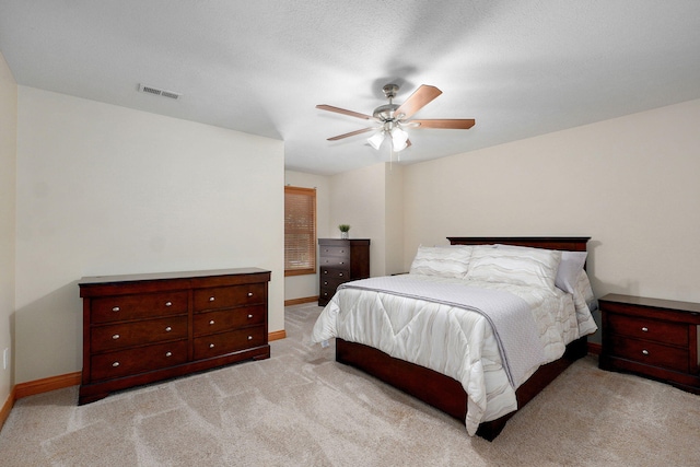 2411 W Dearborn St, Springfield, MO 65807 - bedroom with light colored carpet and ceiling fan