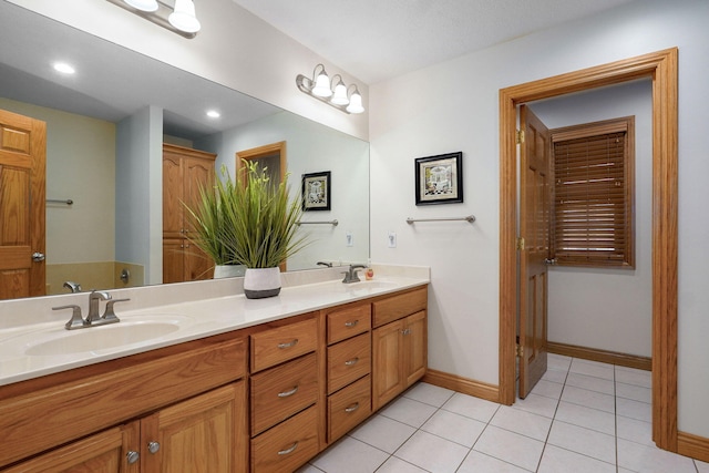 2411 W Dearborn St, Springfield, MO 65807 - full bathroom with double vanity, tile patterned flooring, and recessed lighting