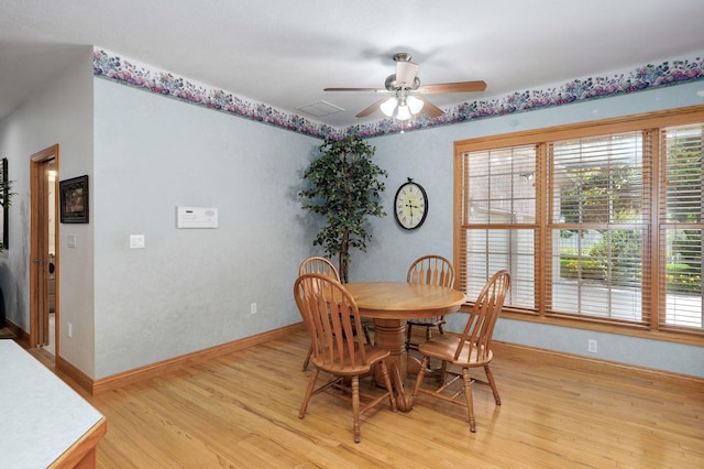 2411 W Dearborn St, Springfield, MO 65807 - dining space featuring ceiling fan and light wood-type flooring