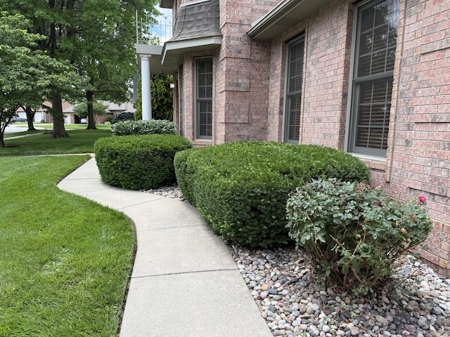 2411 W Dearborn St, Springfield, MO 65807 - view of exterior entry with brick siding and a yard