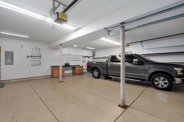 2411 W Dearborn St, Springfield, MO 65807 - garage with a garage door opener and electric panel