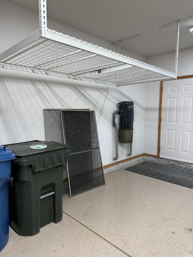 2411 W Dearborn St, Springfield, MO 65807 - garage featuring a central vacuum unit and baseboards