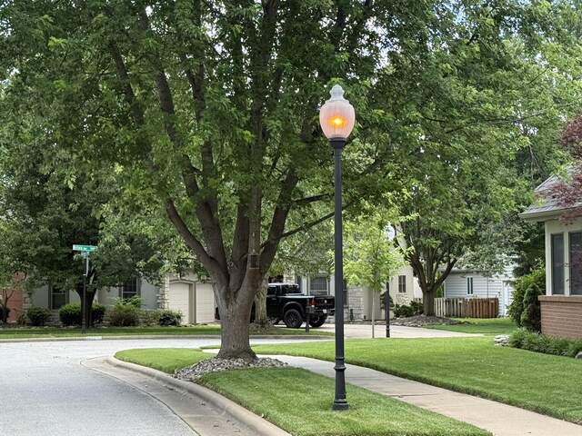 2411 W Dearborn St, Springfield, MO 65807 - view of asphalt road with street lighting, curbs, and sidewalks