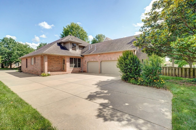 2411 W Dearborn St, Springfield, MO 65807 - view of front of home with brick siding, a garage, concrete driveway, and roof with shingles