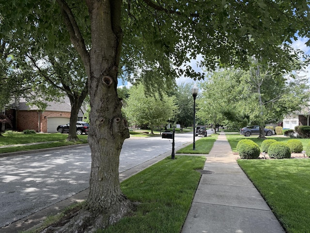 2411 W Dearborn St, Springfield, MO 65807 - view of asphalt road featuring sidewalks, street lights, and curbs