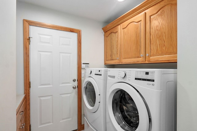 2411 W Dearborn St, Springfield, MO 65807 - laundry area featuring cabinet space and washing machine and clothes dryer