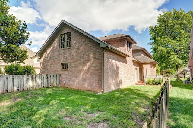 2411 W Dearborn St, Springfield, MO 65807 - view of home's exterior featuring brick siding and a central AC unit