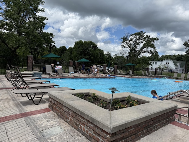 2411 W Dearborn St, Springfield, MO 65807 - community pool featuring a patio