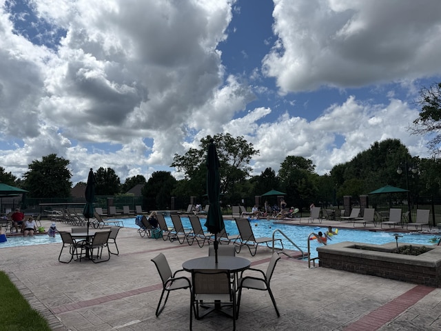 2411 W Dearborn St, Springfield, MO 65807 - community pool featuring a patio