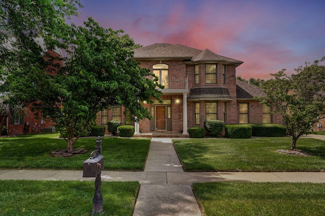 2411 W Dearborn St, Springfield, MO 65807 - view of front of property featuring a yard, brick siding, a balcony, and roof with shingles