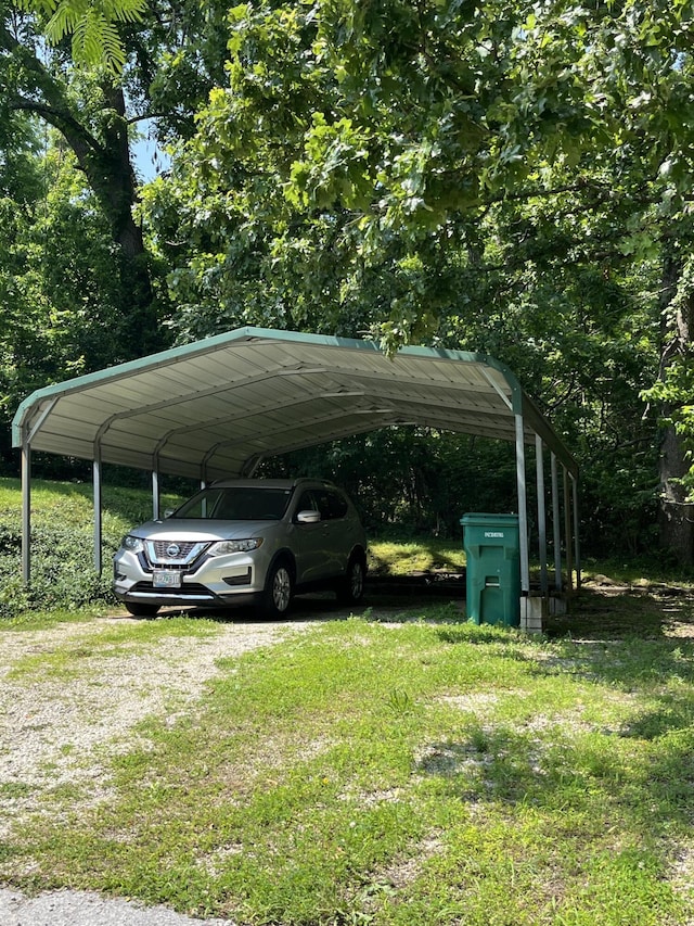 720 Highland St, Cabool, MO 65689 - view of vehicle parking featuring a detached carport