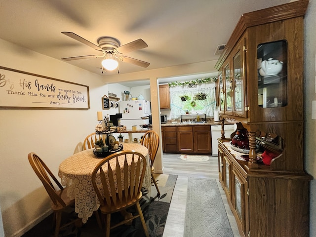 720 Highland St, Cabool, MO 65689 - dining space featuring light wood-type flooring and ceiling fan