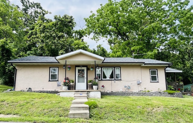 720 Highland St, Cabool, MO 65689 - view of front of property with stucco siding, a front lawn, and a porch