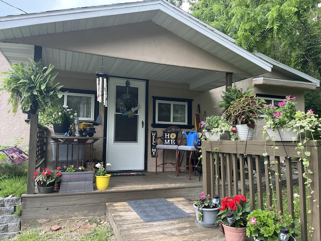 720 Highland St, Cabool, MO 65689 - doorway to property with stucco siding and covered porch