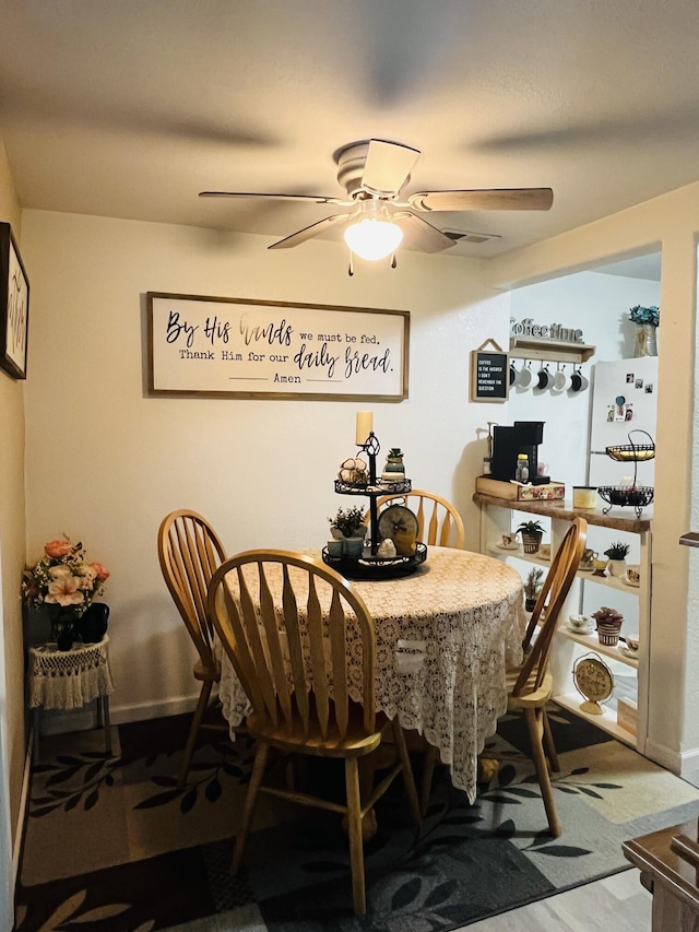 720 Highland St, Cabool, MO 65689 - dining room with a ceiling fan and baseboards