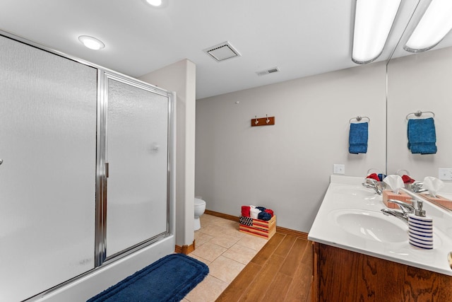 159 Oak Tree Point Ln, Shell Knob, MO 65747 - full bath featuring a stall shower, double vanity, toilet, and baseboards