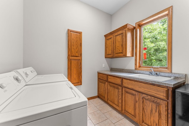 159 Oak Tree Point Ln, Shell Knob, MO 65747 - laundry area featuring washing machine and clothes dryer, cabinet space, and light tile patterned flooring