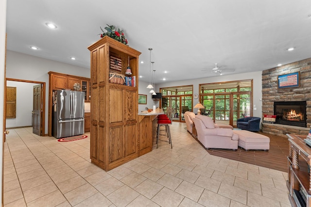 159 Oak Tree Point Ln, Shell Knob, MO 65747 - living area featuring a ceiling fan, light tile patterned floors, a stone fireplace, recessed lighting, and bar area
