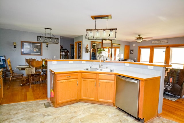 22920 Feaster Branch Rd, Warsaw, MO 65355 - kitchen with stainless steel dishwasher, a sink, ceiling fan, and light countertops