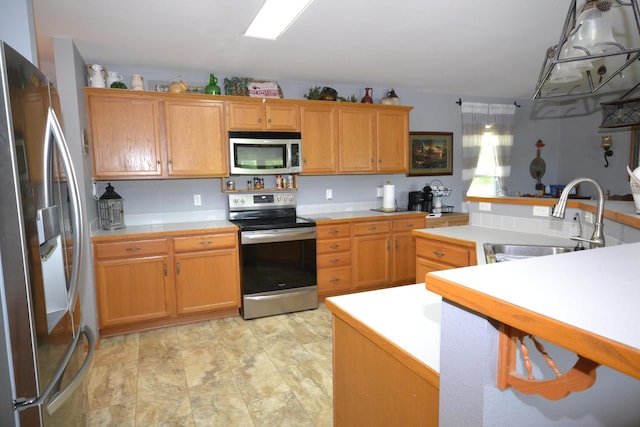 22920 Feaster Branch Rd, Warsaw, MO 65355 - kitchen featuring appliances with stainless steel finishes, a sink, and light countertops