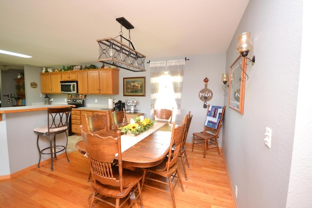 22920 Feaster Branch Rd, Warsaw, MO 65355 - dining space with light wood-style flooring and baseboards